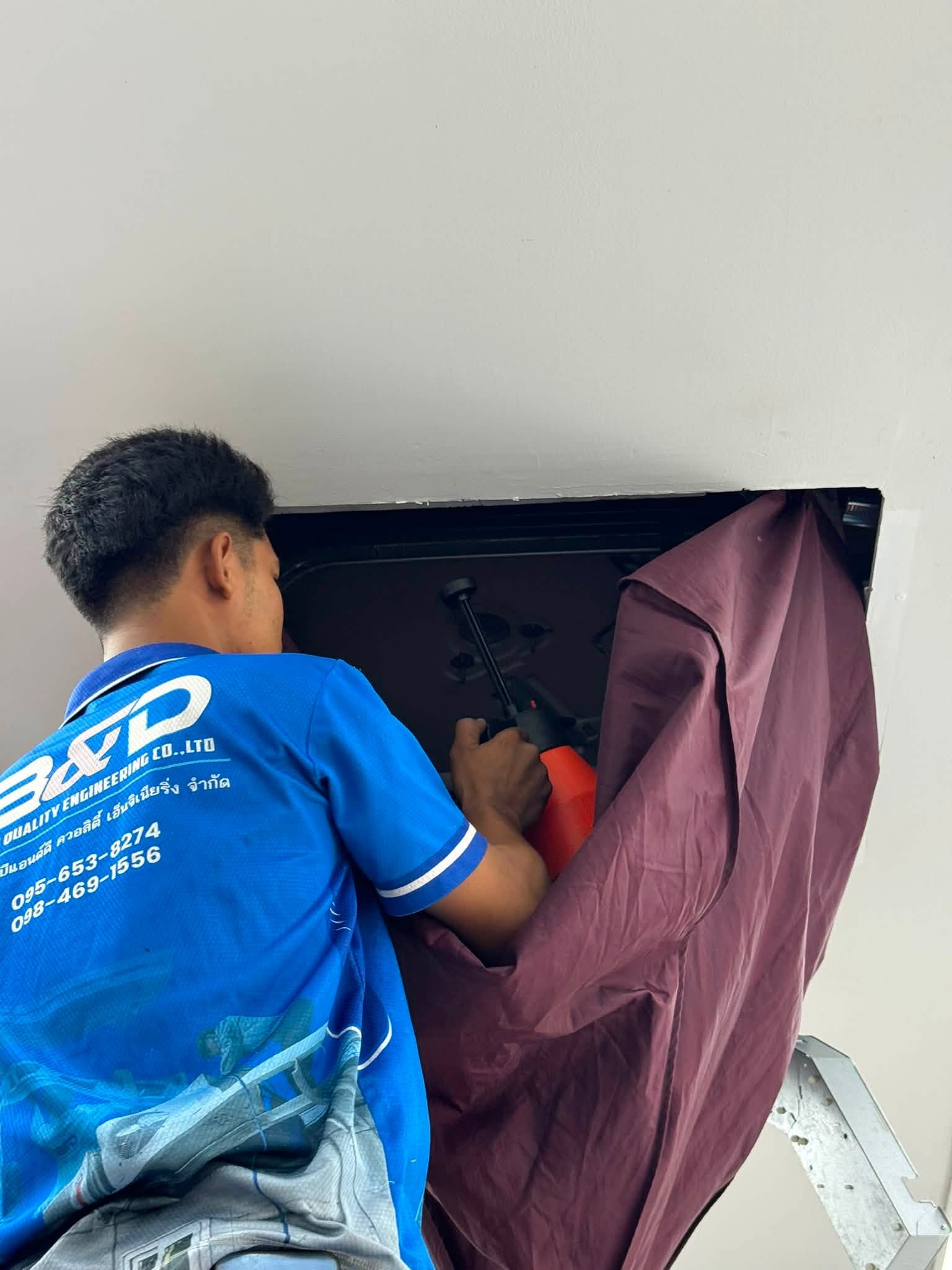 Cleaning bag fitted to a wall unit before washing